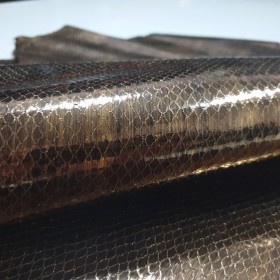 Metal fantasy stamped over goatskin with snake print relief
