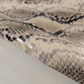 Grabado serpiente estampado natural sobre piel de vacuno