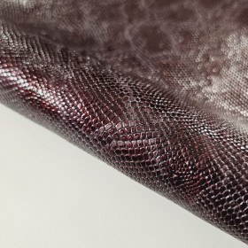 Exclusive finish snake embossed over cowleather side