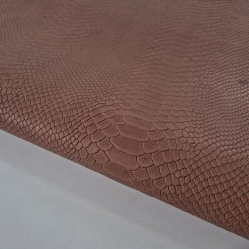 Grabado serpiente sobre piel de cabra marron medio