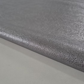 Exclusive silver metallic milled piece of leather.