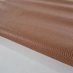 Mediun brown dyed cowleather milled finished